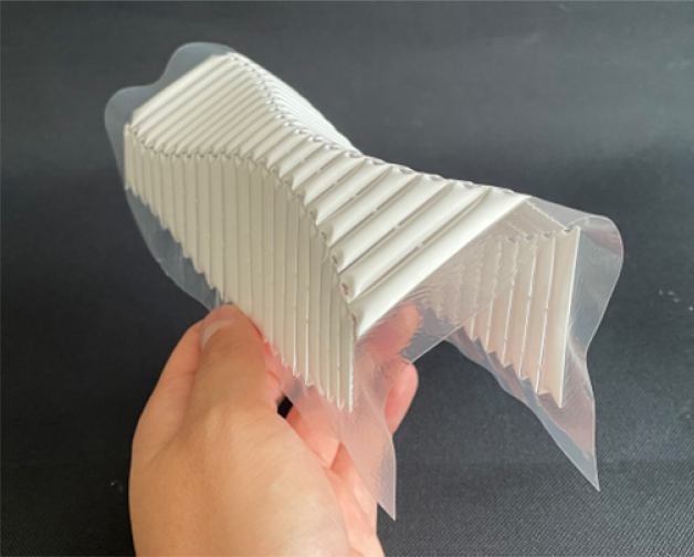 Rigid-ruling Curved Folding Origami Implemented with Straight Inflated Air Pouches